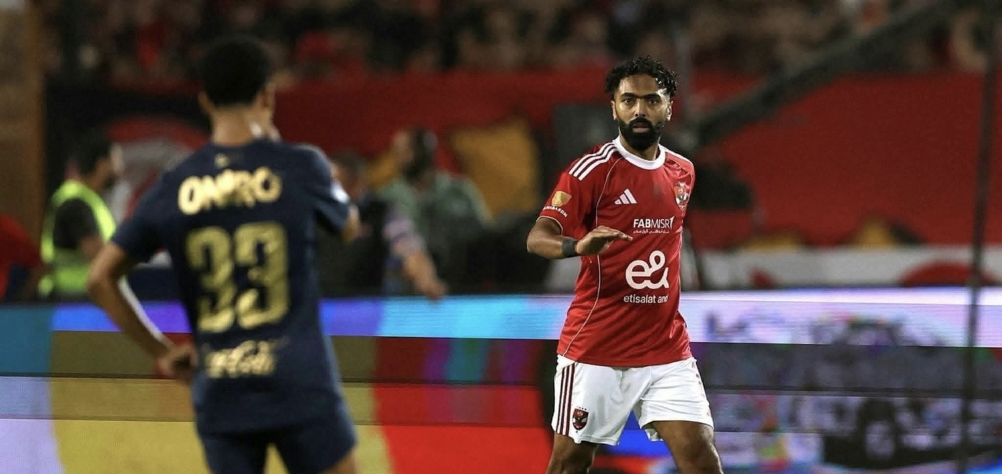 A group of men playing football

AI-generated content may be incorrect.
